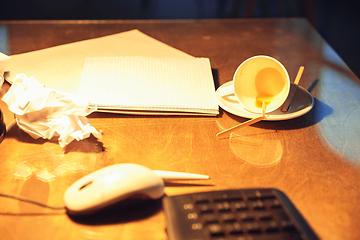 Image showing Office workplace, table of latenight deadlined worker with a mess of coffee cups and papers