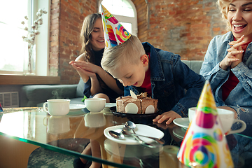 Image showing Mother, son and sister at home having fun, comfort and cozy concept, celebrating birthday