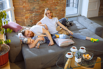 Image showing Mother, father and son at home having fun, comfort and cozy concept