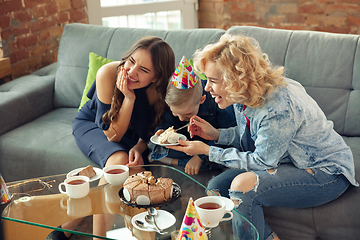 Image showing Mother, son and sister at home having fun, comfort and cozy concept, celebrating birthday