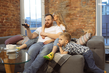 Image showing Mother, father and son at home having fun, comfort and cozy concept