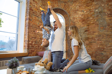 Image showing Mother, father and son at home having fun, comfort and cozy concept