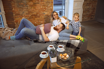 Image showing Mother, father and son at home having fun, comfort and cozy concept