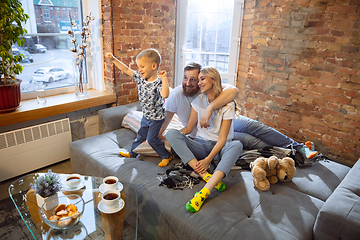 Image showing Mother, father and son at home having fun, comfort and cozy concept