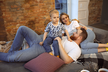 Image showing Mother, father and son at home having fun, comfort and cozy concept