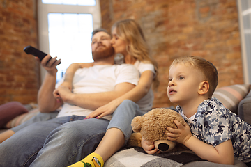 Image showing Mother, father and son at home having fun, comfort and cozy concept