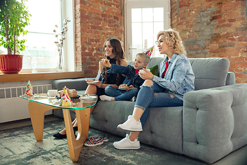 Image showing Mother, son and sister at home having fun, comfort and cozy concept, celebrating birthday