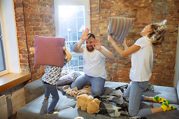 Image showing Mother, father and son at home having fun, comfort and cozy concept