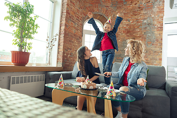 Image showing Mother, son and sister at home having fun, comfort and cozy concept, celebrating birthday