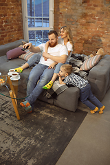 Image showing Mother, father and son at home having fun, comfort and cozy concept