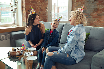 Image showing Mother, son and sister at home having fun, comfort and cozy concept, celebrating birthday