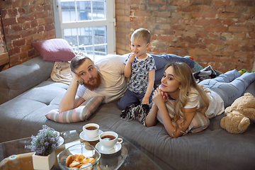 Image showing Mother, father and son at home having fun, comfort and cozy concept