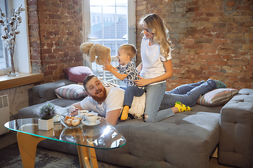 Image showing Mother, father and son at home having fun, comfort and cozy concept