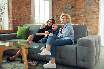 Image showing Mother, son and sister at home having fun, comfort and cozy concept, celebrating birthday