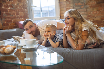 Image showing Mother, father and son at home having fun, comfort and cozy concept