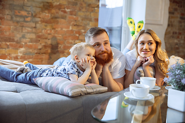 Image showing Mother, father and son at home having fun, comfort and cozy concept