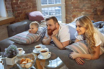 Image showing Mother, father and son at home having fun, comfort and cozy concept