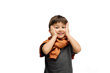 Image showing Happy caucasian little boy isolated on white studio background. Looks happy, cheerful, sincere. Copyspace. Childhood, education, emotions concept