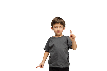 Image showing Happy caucasian little boy isolated on white studio background. Looks happy, cheerful, sincere. Copyspace. Childhood, education, emotions concept