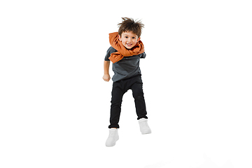 Image showing Happy caucasian little boy isolated on white studio background. Looks happy, cheerful, sincere. Copyspace. Childhood, education, emotions concept