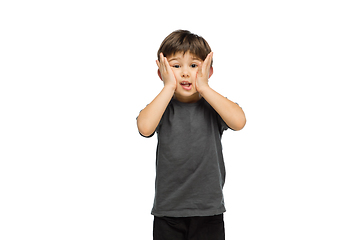 Image showing Happy caucasian little boy isolated on white studio background. Looks happy, cheerful, sincere. Copyspace. Childhood, education, emotions concept