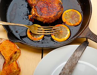 Image showing pork chop seared on iron skillet