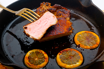 Image showing pork chop seared on iron skillet