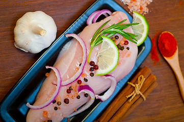 Image showing fresh organic chicken breast with herbs and spices