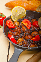 Image showing Baby cuttle fish roasted on iron skillet