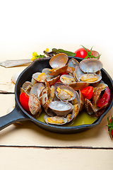 Image showing fresh clams on an iron skillet