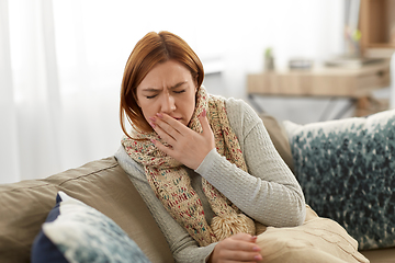 Image showing sick woman in scarf coughing at home