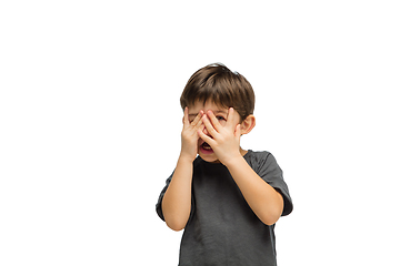 Image showing Happy caucasian little boy isolated on white studio background. Looks happy, cheerful, sincere. Copyspace. Childhood, education, emotions concept