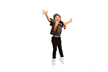 Image showing Happy caucasian little boy isolated on white studio background. Looks happy, cheerful, sincere. Copyspace. Childhood, education, emotions concept