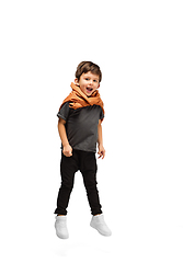 Image showing Happy caucasian little boy isolated on white studio background. Looks happy, cheerful, sincere. Copyspace. Childhood, education, emotions concept