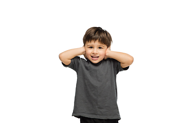 Image showing Happy caucasian little boy isolated on white studio background. Looks happy, cheerful, sincere. Copyspace. Childhood, education, emotions concept