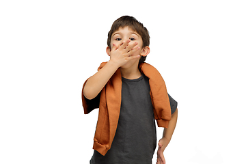 Image showing Happy caucasian little boy isolated on white studio background. Looks happy, cheerful, sincere. Copyspace. Childhood, education, emotions concept