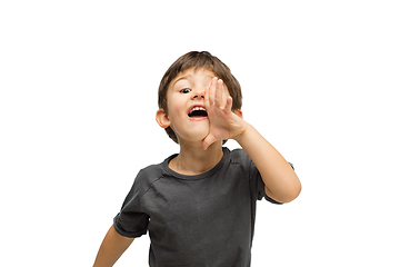 Image showing Happy caucasian little boy isolated on white studio background. Looks happy, cheerful, sincere. Copyspace. Childhood, education, emotions concept