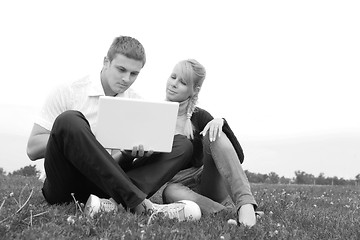 Image showing young man and girl blonde with laptop