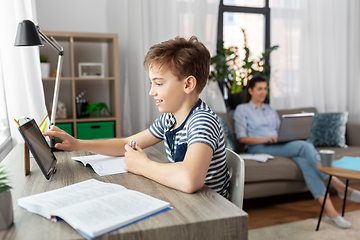 Image showing student boy with tablet computer learning at home