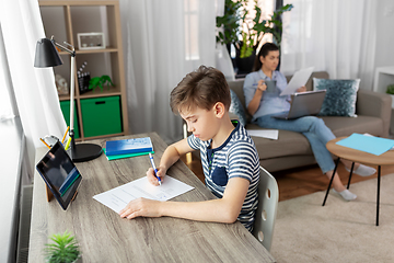 Image showing student boy with tablet computer learning at home