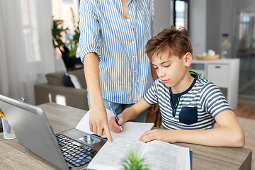 Image showing mother and son doing homework together