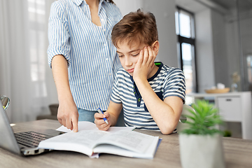 Image showing mother and son doing homework together