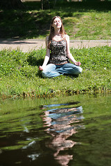 Image showing young woman near water