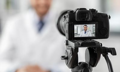 Image showing male doctor recording video blog at hospital