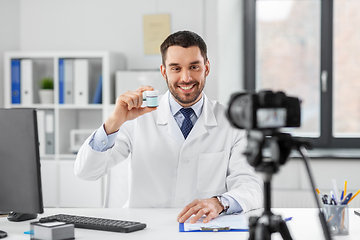 Image showing doctor with drug recording video blog at hospital