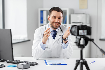 Image showing male doctor recording video blog at hospital