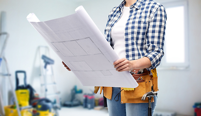 Image showing female builder with blueprint and working tools