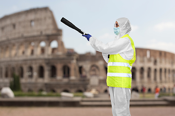 Image showing sanitation worker in hazmat with pressure washer