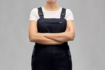 Image showing close up of female painter or builder in overall