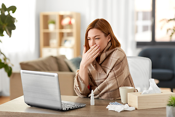 Image showing sick woman having video call on laptop at home